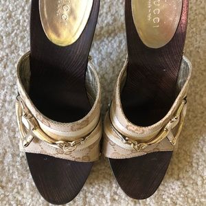 High heeled gold Gucci sandals.